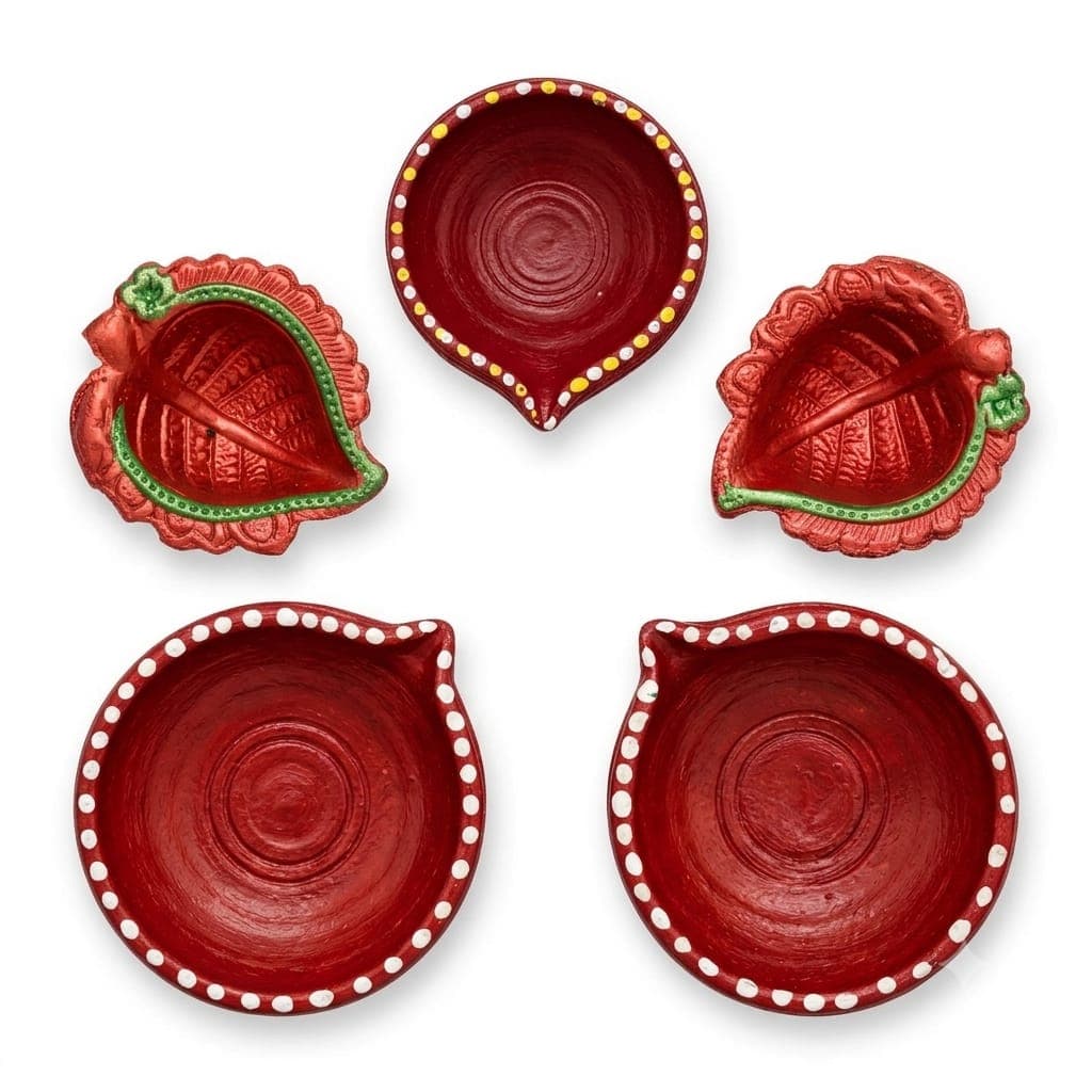 Terracotta diyas painted in red with decorative borders