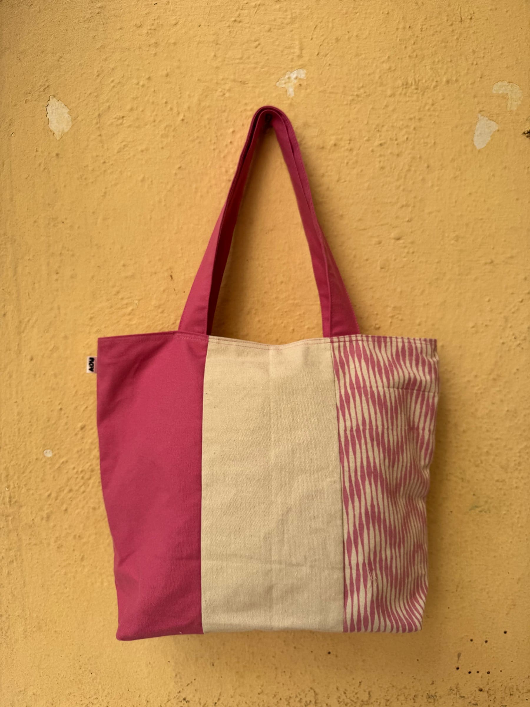 Large colour-block tote in rose pink and cream with a fine red stripe panel