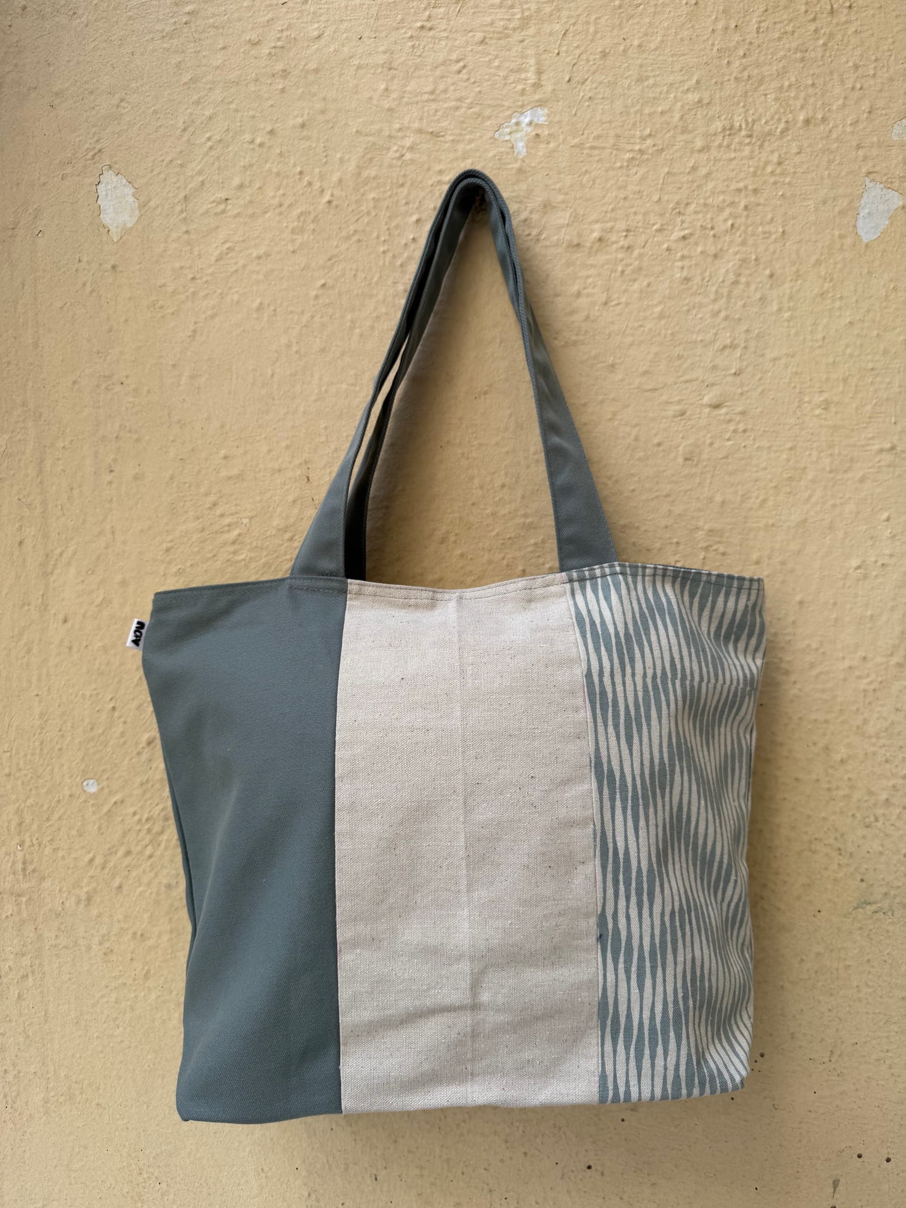 Large colour-block tote in slate grey and cream with a blue zigzag stripe panel