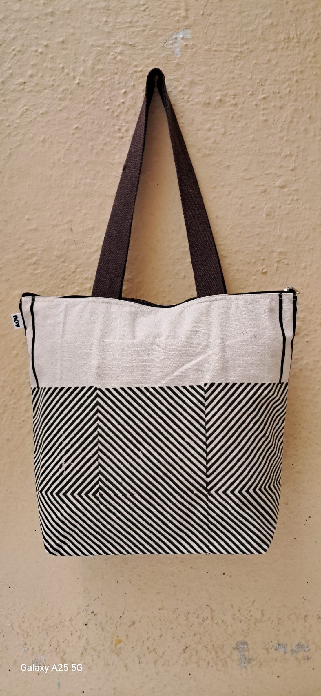 Cotton tote in black and white florals with a printed grid panel, black handles