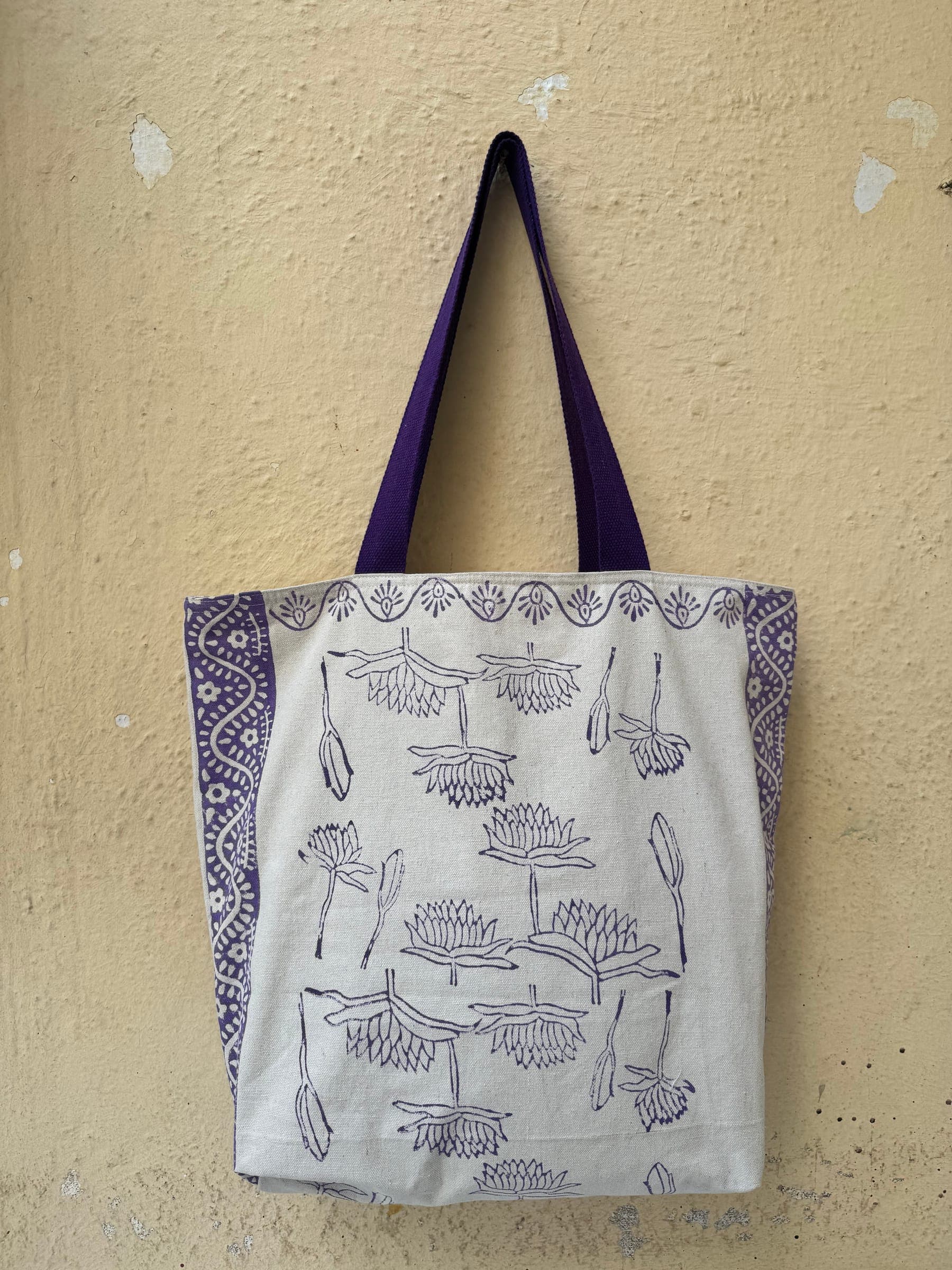 Cotton tote block-printed with pink roses and scalloped flower rows on cream